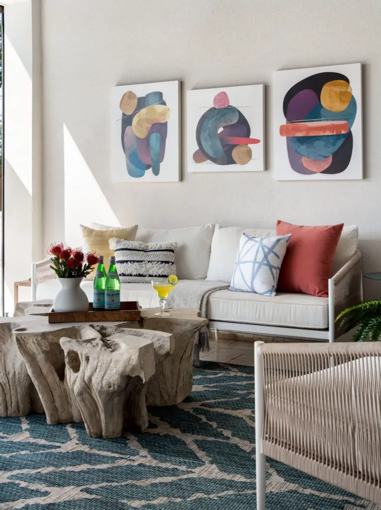 Bold artwork and vibrant colors make the outdoor living area come alive.