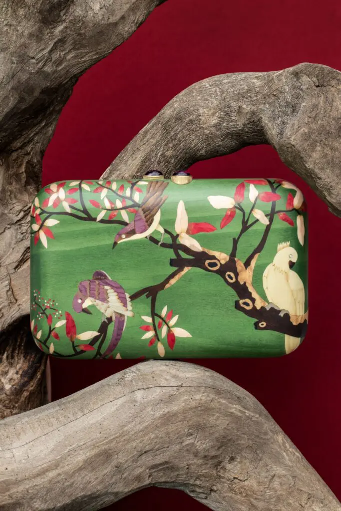Green bird marquetry clutch with diamonds and pink tourmaline clasp.