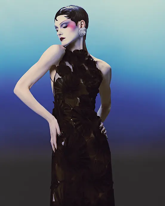 Akris tulle gown with anemone silk organza flowers $9,950 at Akris Highland Park Village, Neiman Marcus, Balmain lion earrings in brass with crystals, at Balmain Highland Park Village, Neiman Marcus. 