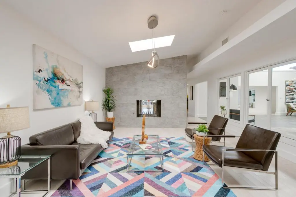 3401 Dorothy Lane's cozy den with a see-through fireplace.