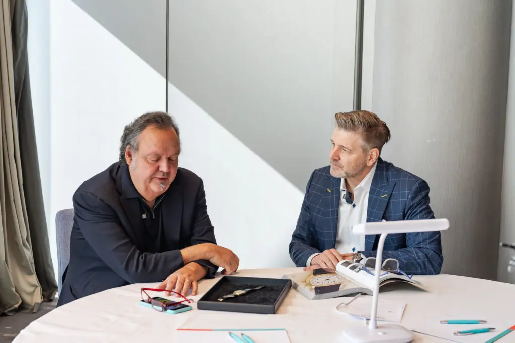 Monaco Legend Group chairman Davide Parmegiani with Houstonian Rob Chramosta and the Sir Henry Segrave Patek Philippe watch.(Courtesy photo)