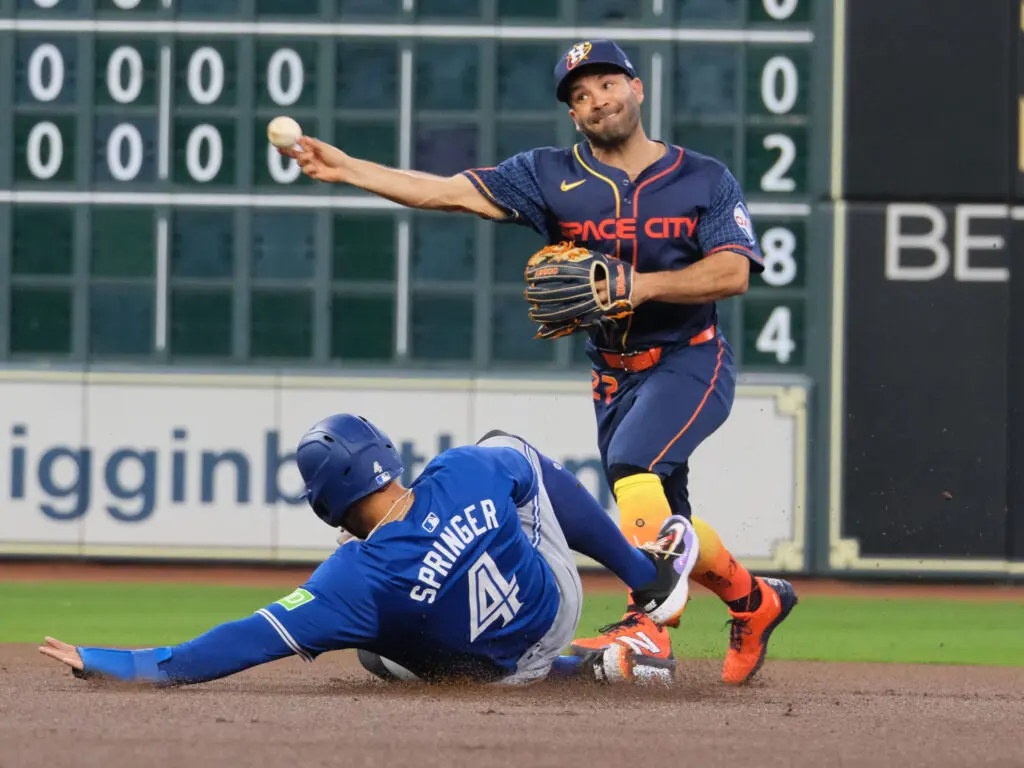 Houston Astros second baseman Jose Altuve and old buddy George Springer are used to meeting by now. (Photo by F. Carter Smith)