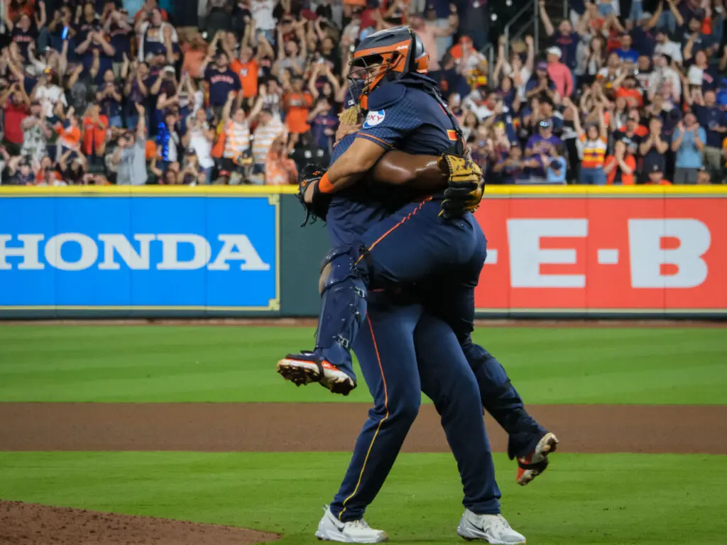 Houston Astros pitcher Ronel Blanco lifted  catcher Yainer Diaz in his arms after throwing a no hitter. (Photo by F. Carter Smith) 
