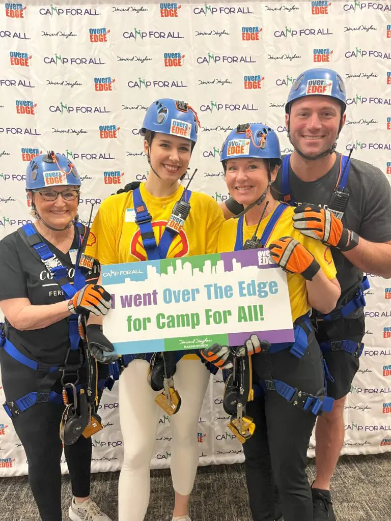 Beth Ferester-Corcoran, Annie Morelli, Stacie Pitts and Jonathan Ruzicka scaled the Howard Hughes building. (Photo by Courtesy of Camp for All)