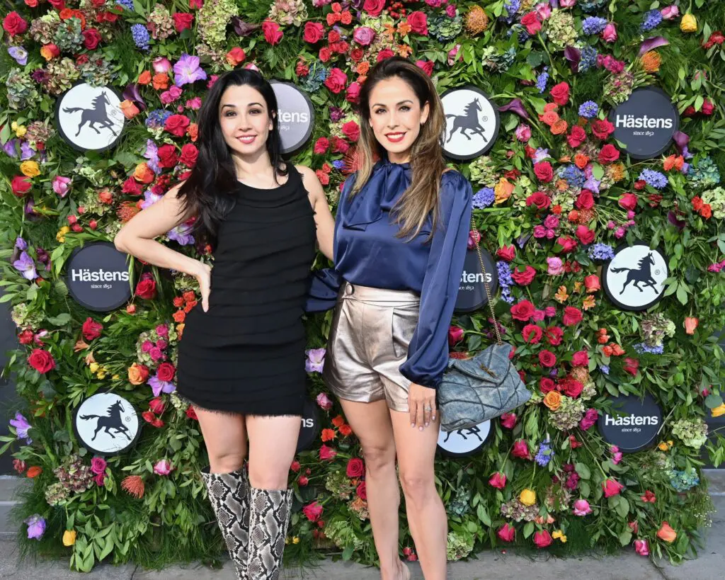 Dennise Carranza, Anya Carranza post at the flower wall before visiting Hästens in River Oaks District. (Photo by Alex Montoya)