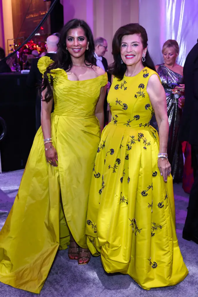 Elizabeth Colombowala, Dancie Ware in Oscar de la Renta, both in stylish butter yellow, at the Houston Grand Opera 'Mirror Ball'  (Photo by Michelle Watson, Catchlightgroup.com)