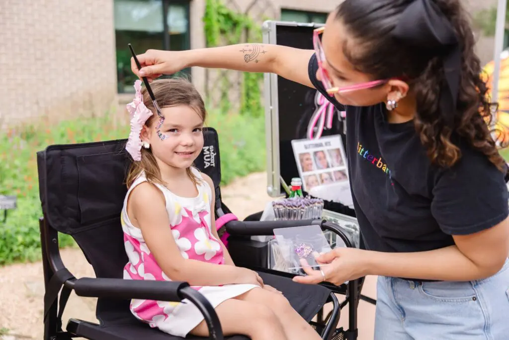 Ellie TenHoeve enjoys face painting at the Ambassadors for Texas Children’s Hospital Family Fun Day (Photo by Johnny Than)
