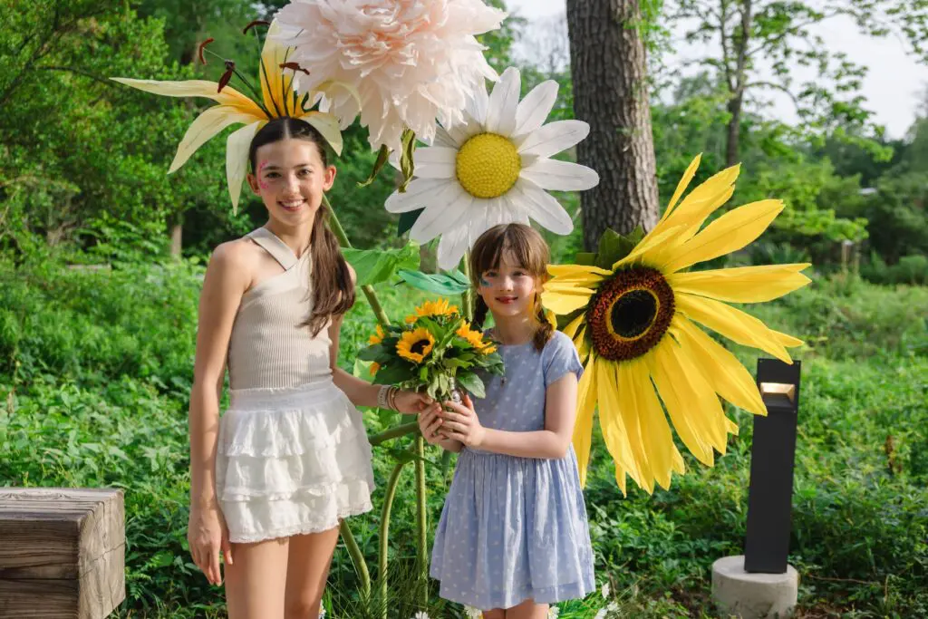 Daughters of Carolyn and Jake Sabat have a colorful blast at the Ambassadors for Texas Children’s Hospital Family Fun Day. (Photo by Johnny Than)