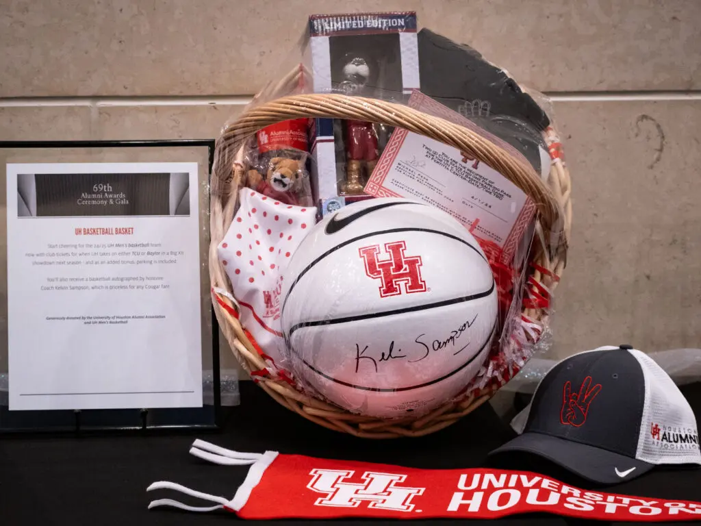 A variety of UH prizes went up for auction, including a signed Kelvin Sampson basketball basket. (Photo by F. Carter Smith)