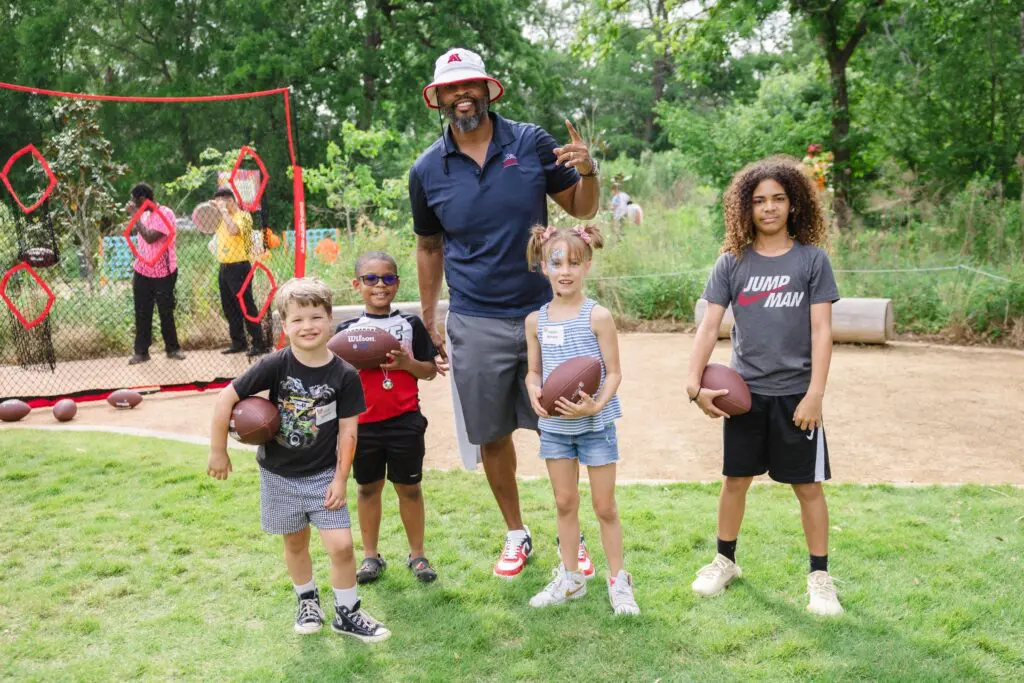 Wade Smith with youngsters at the Ambassadors for Texas Children’s Hospital Family Fun Day (Photo by Johnny Than)