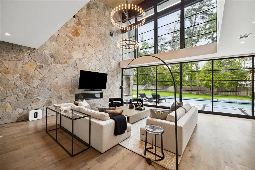 Take a look inside this modern masterpiece and admire the seamless flow between indoor and outdoor living.  (Photo by TK Images)