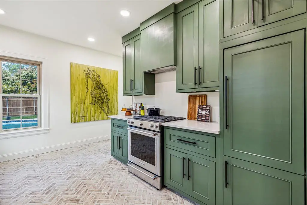 Herringbone-laid brick lines the kitchen. 