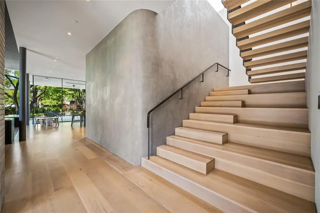 A unique, minimal stairwell sets the tone. 