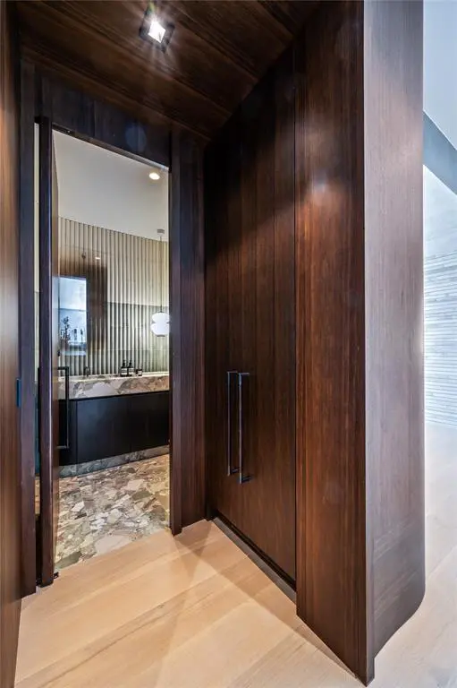 Custom full height white oak interior doors feature throughout the home. 