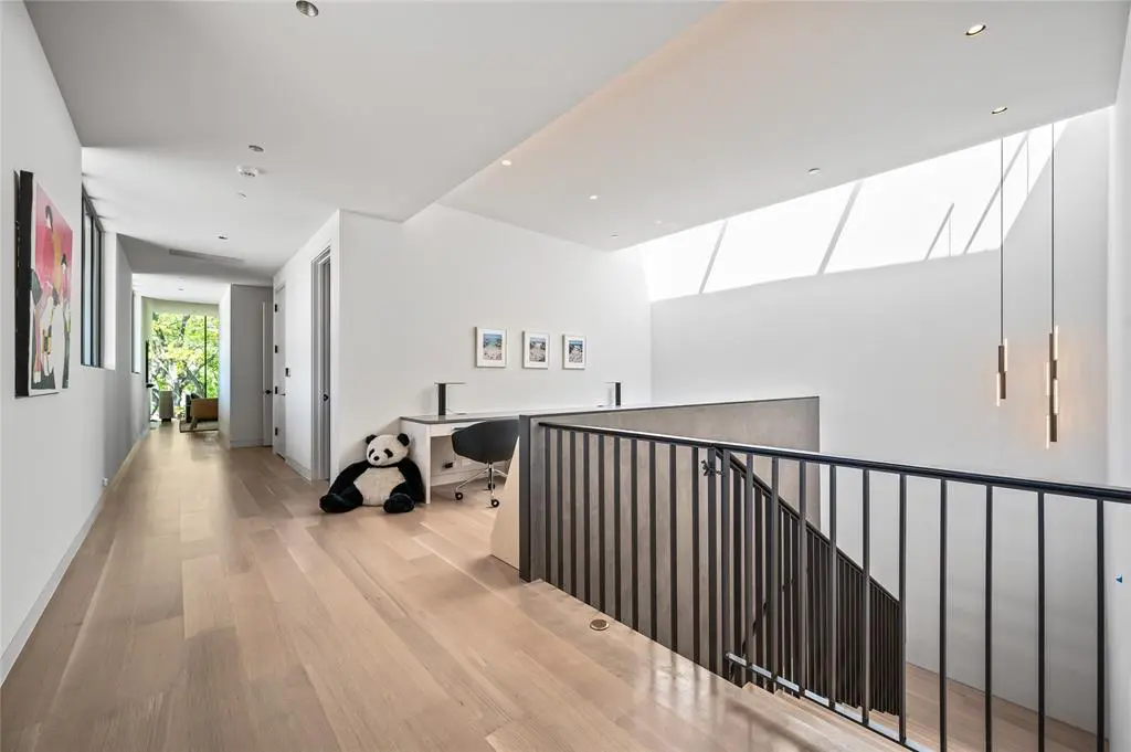 An upstairs landing doubles as an office or playroom.