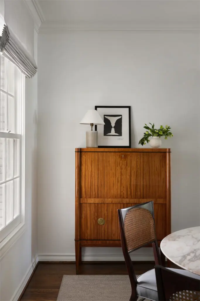Art Deco bar cabinet by De Coene Frères from Belgium. Jasper Johns 1973 lithograph from Artsy. Vintage 1950s Italian marble table from Milan. Vintage 1950s Paul McCobb chair. Lamp by Dumais Made, Connecticut. (Photo by Trevor Parker)