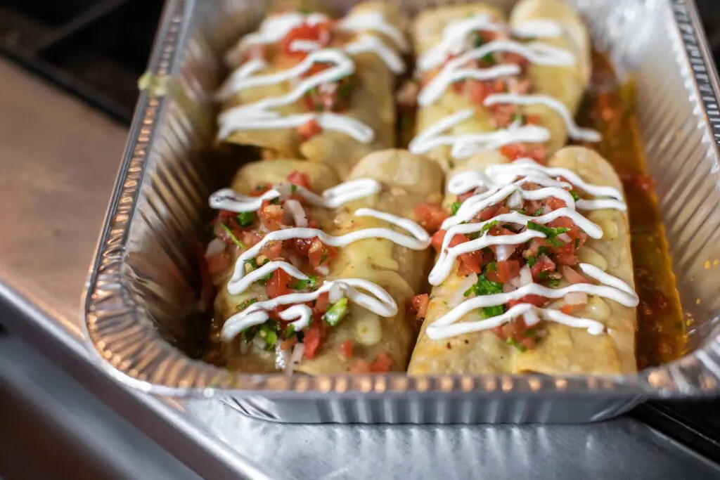 Ta da! The finished product — Brennan's crawfish enchiladas are available at Belong Kitchen to take out and enjoy at home. (Photo by Marlo Wise)