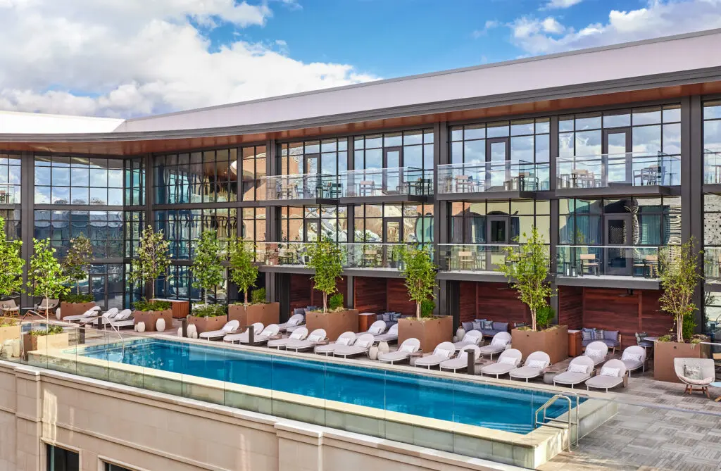 The private Bowie House terrace features a heated pool, a hot tub, private cabanas, and a bar.