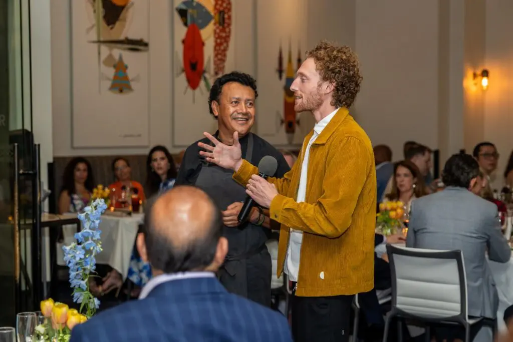 Chef Hugo Ortega and dancer Skylar Campbell share the inspiration behind their dish at the Houston Ballet 'Raising the Barre' dinner at Caracol. (Photo by Melissa Taylor)