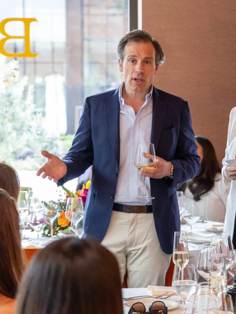 Giorgio Bulgari discussing his Giorgio B collection with de Boulle guests lunching at Bari (Photo by Jordan Geibel)