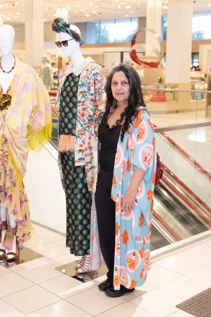 Judy Masliyah with her 'Candy Crush Boudoir' and 'Silken Cocoon Coat Dress' kimonos on display at Kimono Zulu fashion exhibition at Neiman Marcus (Photo by Wilson Parish