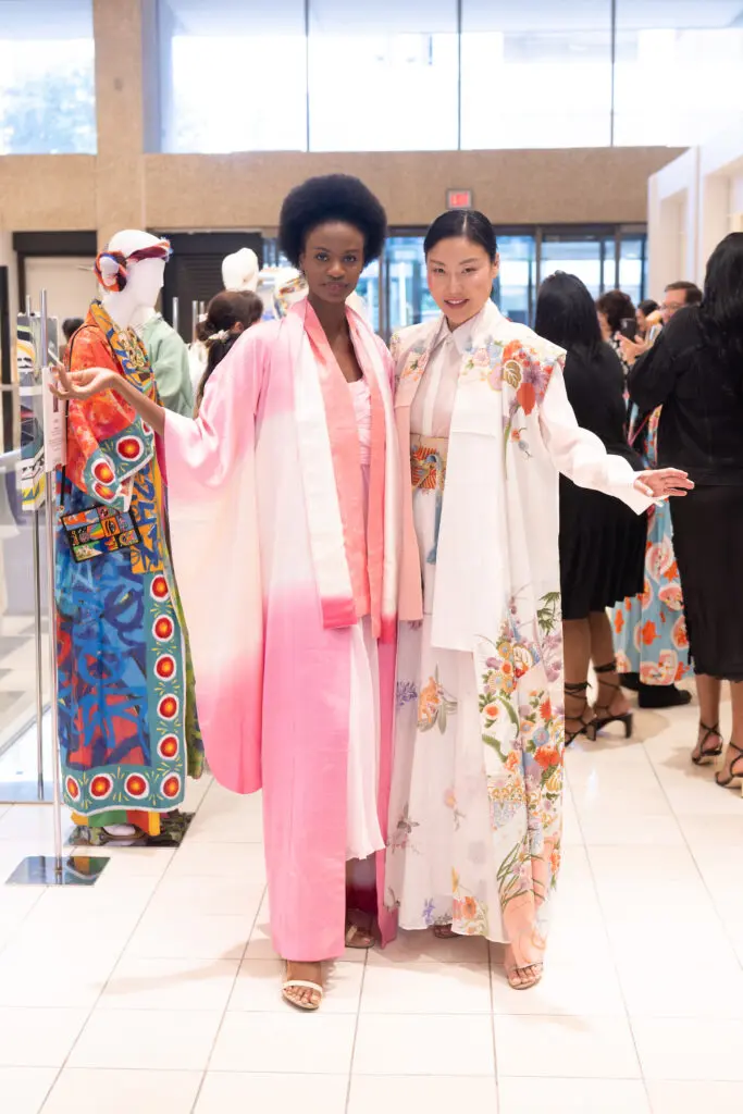 Models wearing 'Cotton Candy Clouds' (Left) & 'Mother Earth' (Right) Kimono designs at Kimono Zulu fashion exhibition at Neiman Marcus (Photo by Wilson Parish)