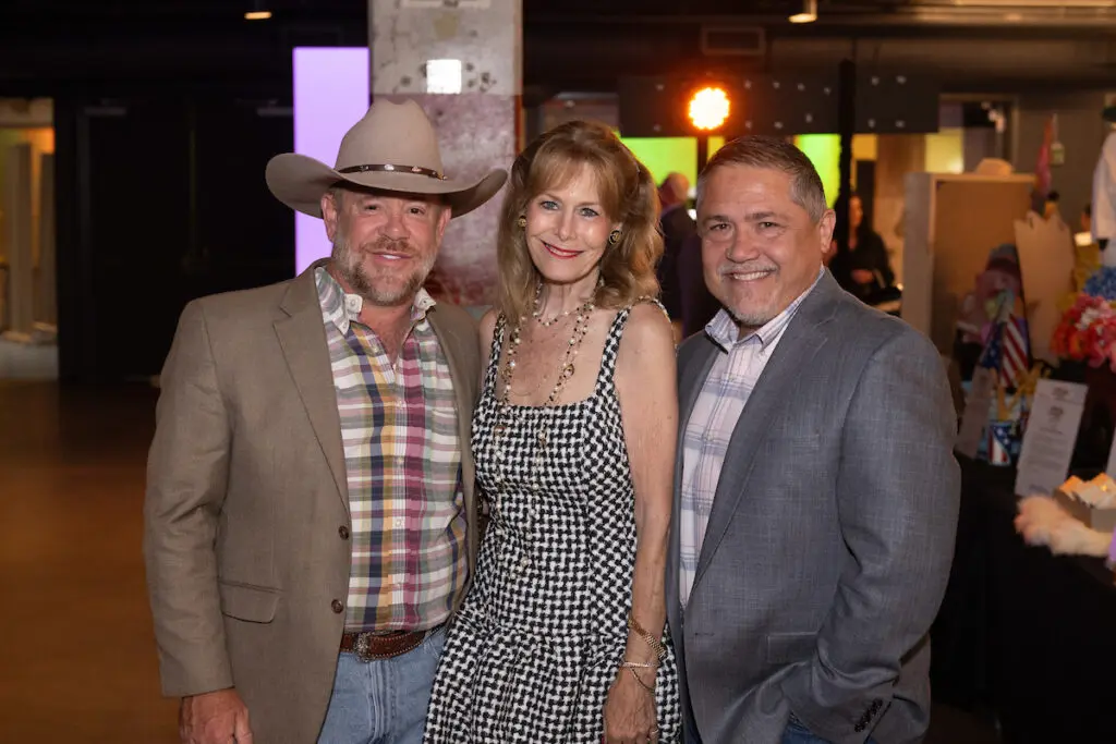 Shelby Kibodeaux, Cheryl Byington, Bruce Padilla at the VICTORY Rally Ball (Photo by Wilson Parish)