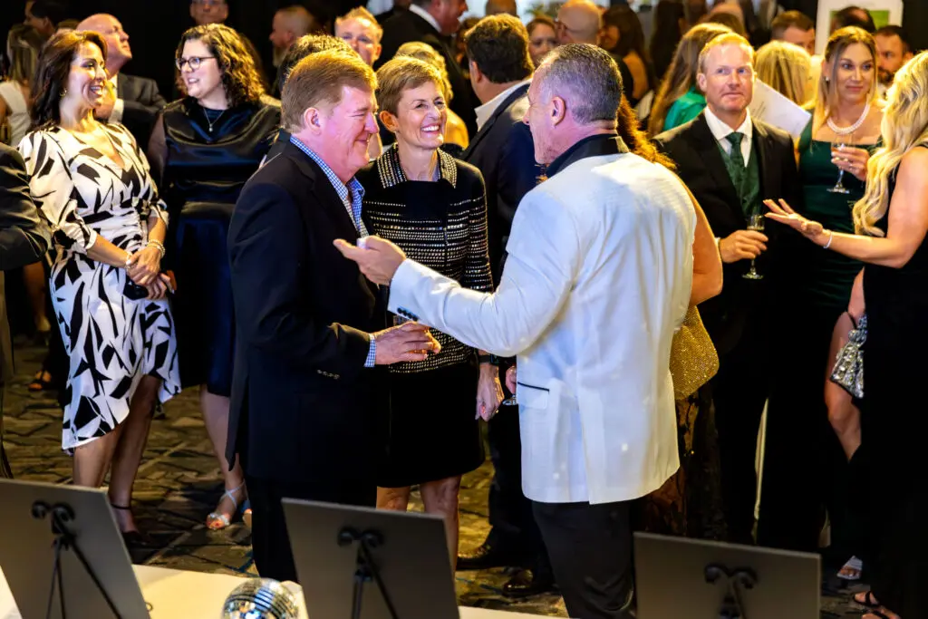 TWCA’s head of school Julie Ambler and Price Ambler mingle with Anthony George, chief governance officer of the school's Governance Board. (Photo by The Woodlands Christian Academy)