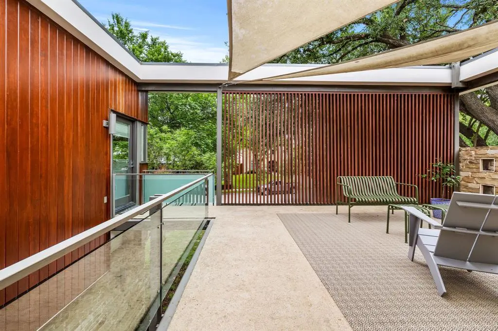 The towering slat wall brings high design and privacy to the rooftop deck. 