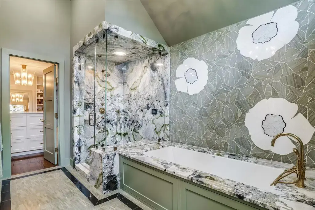 Unique stonework in the primary bathroom, which features a bidet and a linen closet.