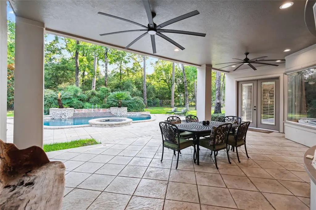 The covered patio area has fans to keep everyone cool during hot Texas days. 