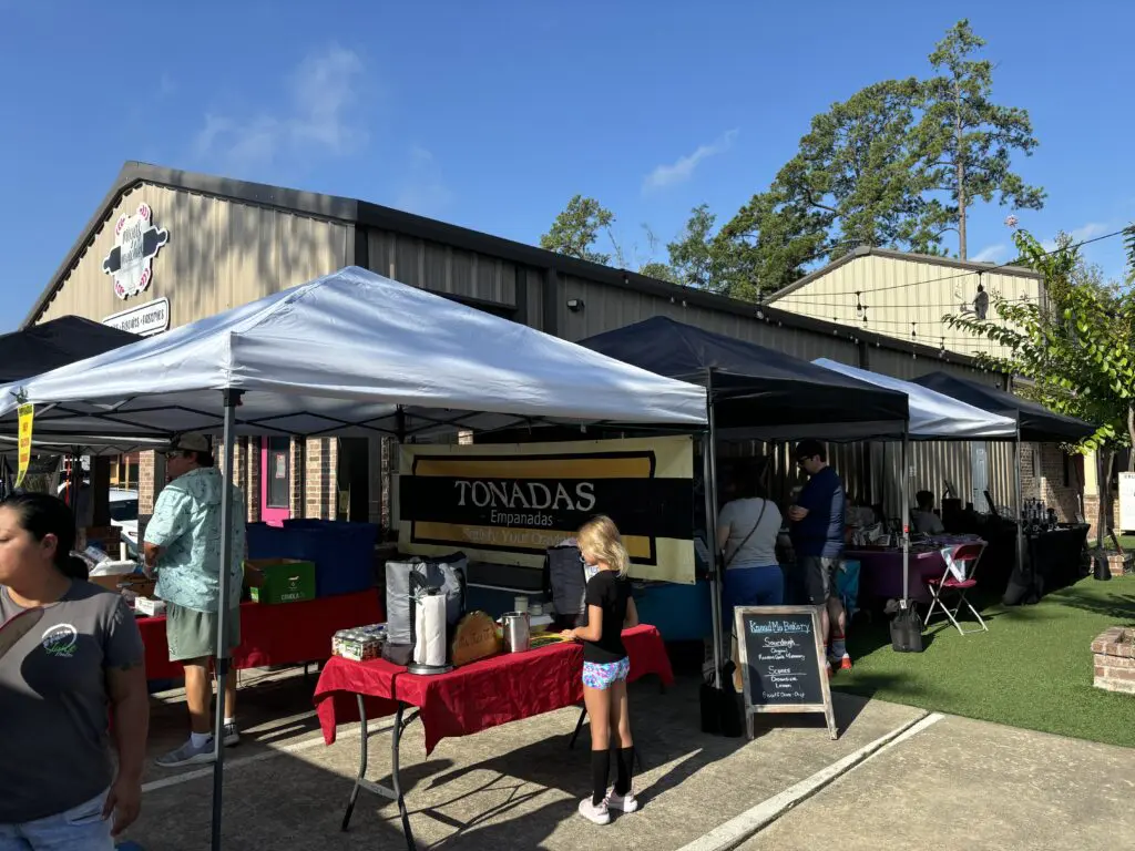 The Tamina farmers market is nestled among small restaurants in the Culinary Courtyard, including Brick and Brews. (Photo by Laura Landsbaum)