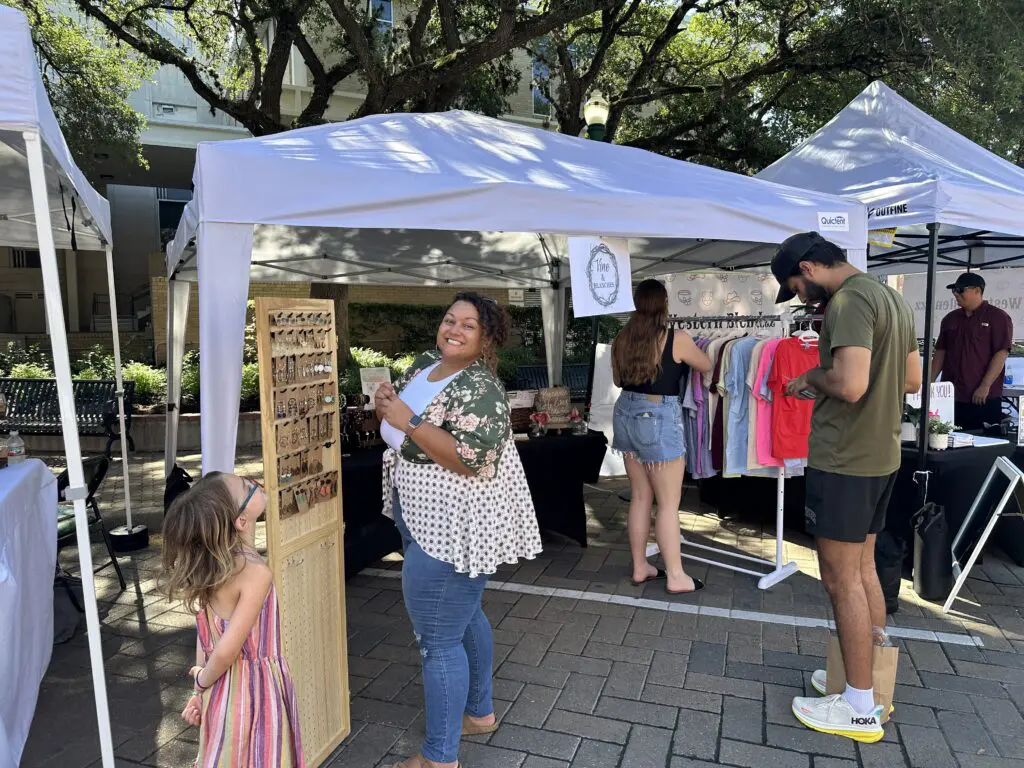Clothing and jewelry makers are among the many offerings at the weekly Main Street Market in Conroe. (Photo by Farralyn Withrow)