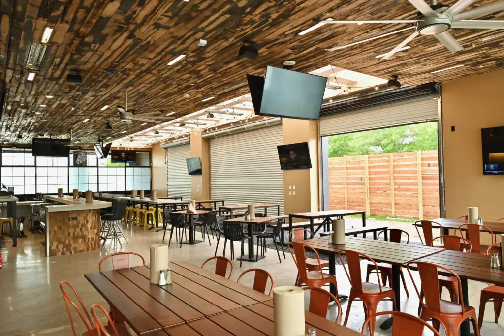 This spring, Sambrooks and his pit crew took up a second residence setting up The Pit Room in Memorial City in an even larger space. With 6,300 square feet inside as well as two fully stocked bars (and another 2,600 square feet out on the covered patio) the newest outpost can seat 228. (Photo by Alex Montoya)