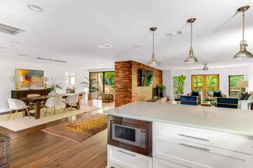 The mid-century open-flow concept at 2365 Park Place combines living, den, kitchen, and dining in on vast space.