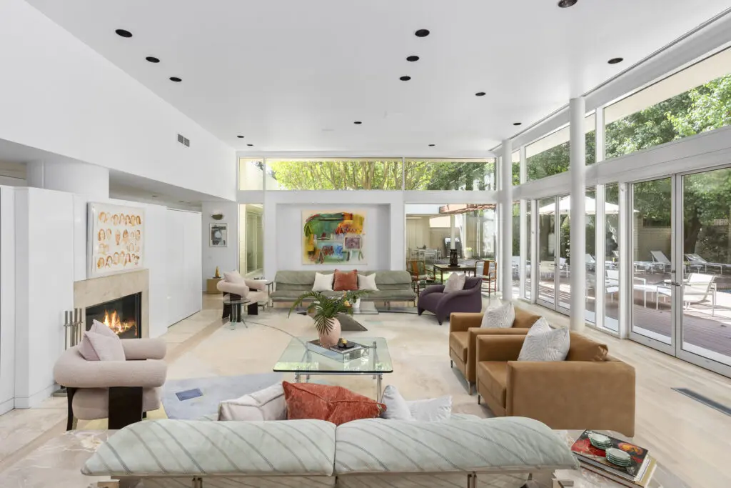 3950 Sarita Park Court's living room with massive windows and art walls is a stunner.