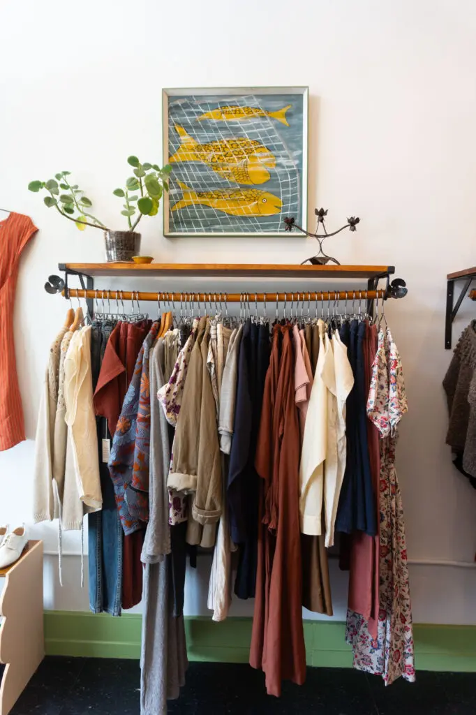 Clothing rack and vintage fish art at Ollie Shop (Photo by Sofia Westerman) 