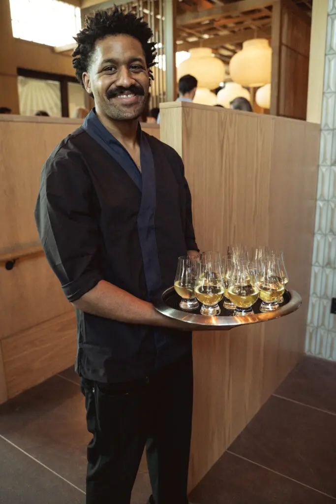 Sake flows throughout the evening at the opening of Azumi in River Oaks District. (Photo by Jonah Tijerina)