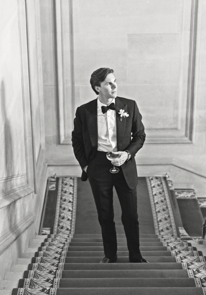 Groom Mack Abbot takes moment on the stairs of Cercle de I’Union Interalliée. (Photo by John Cain Photography)