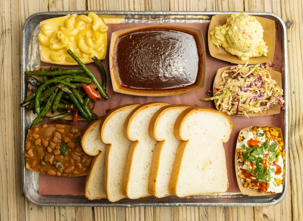 The homemade sides at the Pit Room include macaroni and cheese, mustard potato salad, elote, charro beans, coleslaw and green beans. (Photo by Duc Hoang)