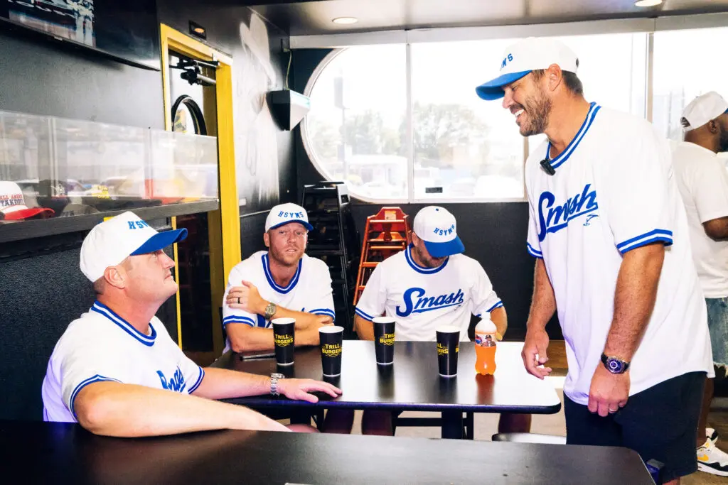 Brooks Koepka tries to make Jason Kokrak laugh at Trill Burgers. (Photo by Dylan McEwan)