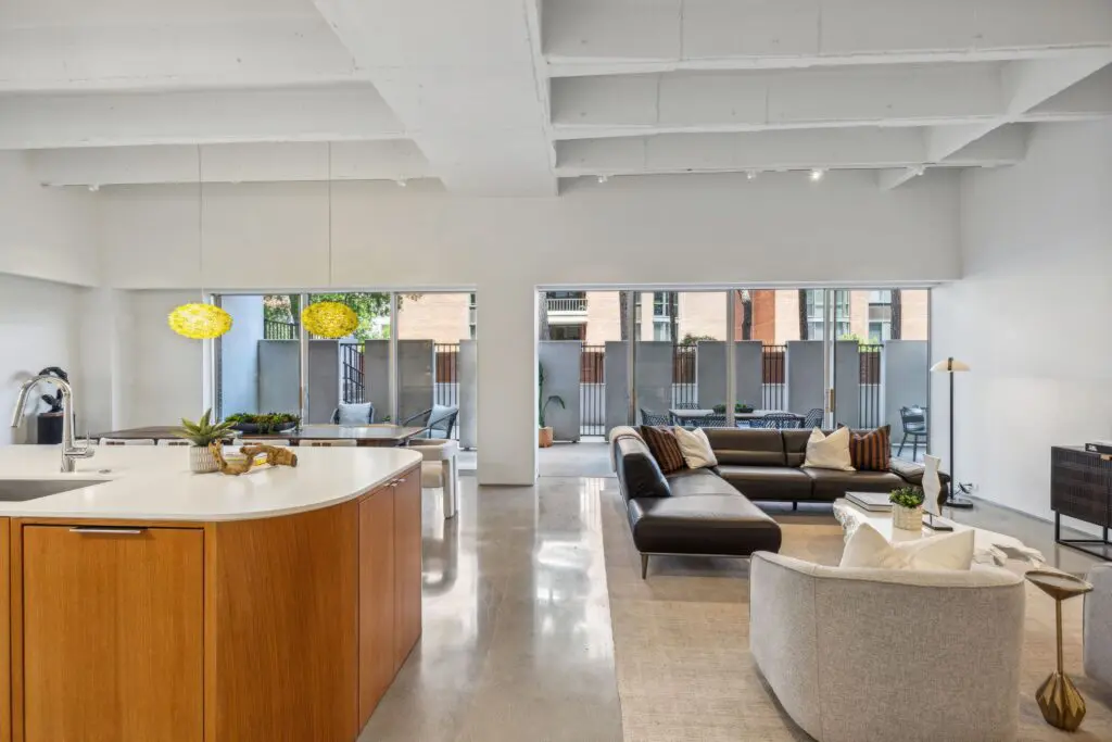The home was stripped down to its modernist essence, revealing polished concrete floors and ceiling beams.