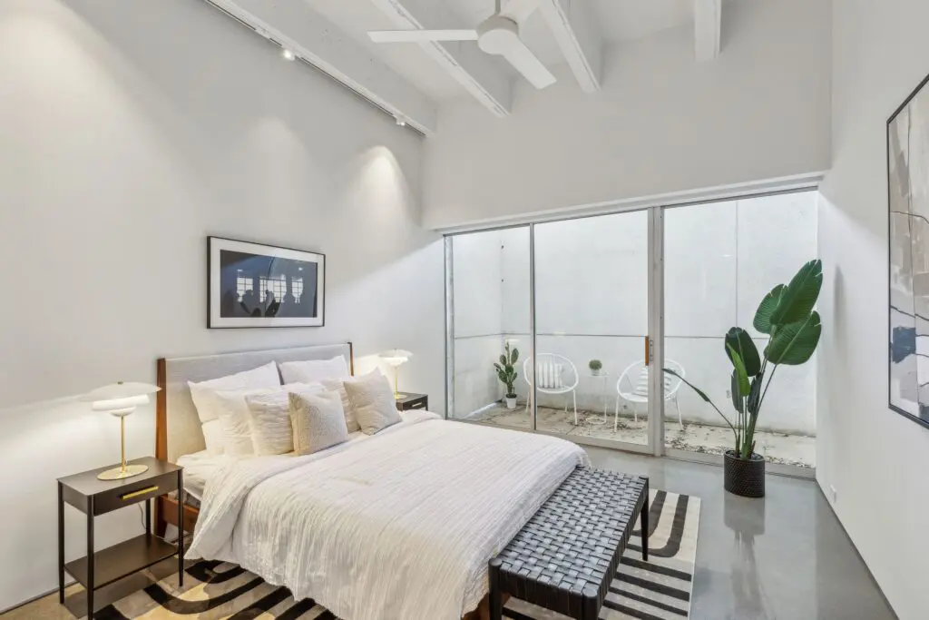 A second bedroom that opens up to the expansive private terrace. 