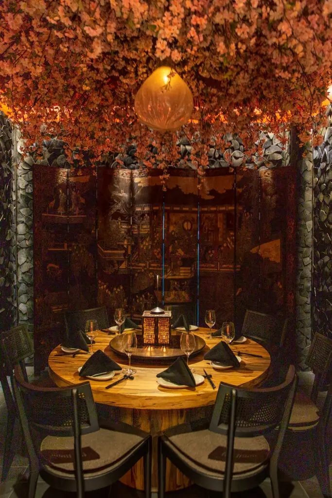 A bower of silk cherry blossoms blankets the ceiling in the private 
Cherry Blossom room at Benny Chows
