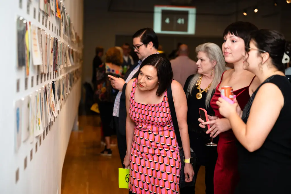 Brandon Zech, Julia Barbosa Landois, Heidi Vaughan, Angela Guerra Walley check out the art work at DiverseWorks Luck of the Draw. (Photo by Tasha Gorel / Natasha Nivan Productions) 