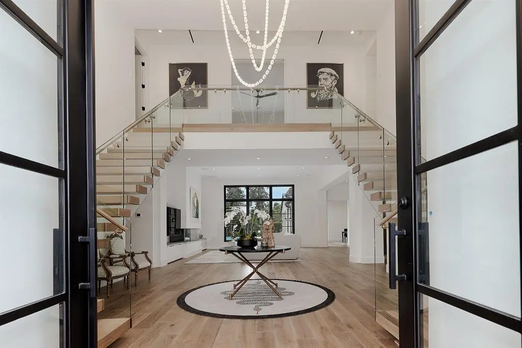 The two-story entryway is a beautiful introduction to the home. 