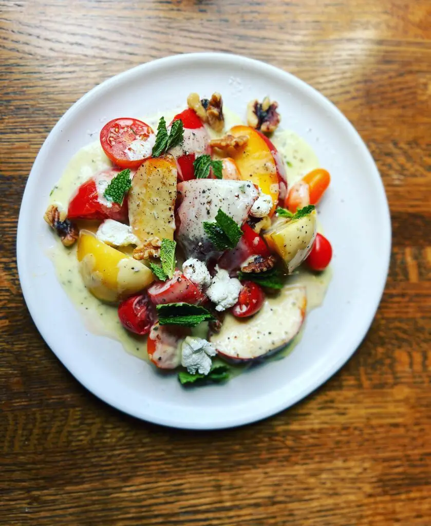Willow Park to get its own Cork & Pig Tavern. A peach heirloom salad is shown here.