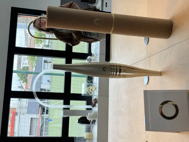Visitors to Lehanneur's The Factory admire the 2024 Summer Olympics torch. (Photo by Donatella Benckenstein)