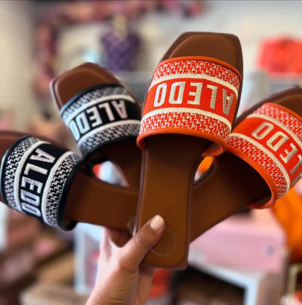 At The Market at Aledo, Cowtown Couture is even stocked with "Aledo" slides for $54.