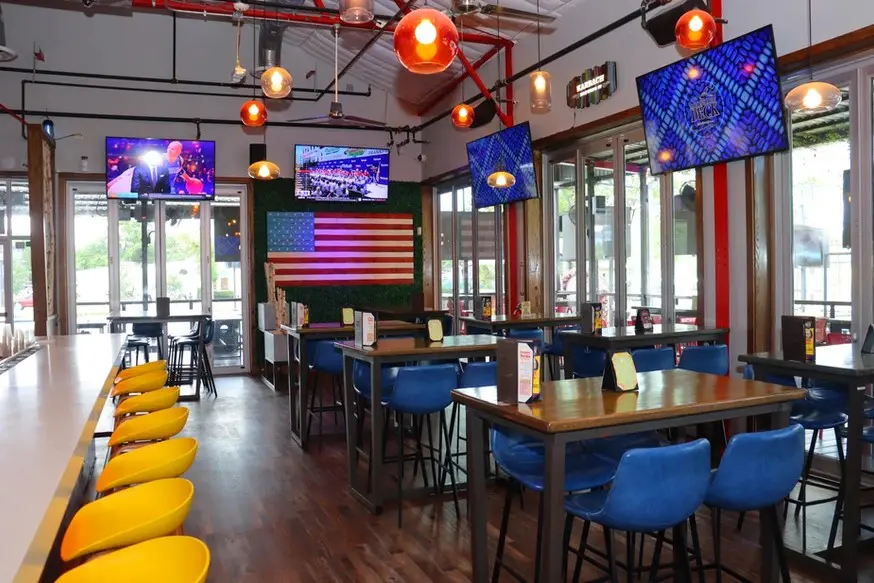 Moonshine Deck in Magnolia is the perfect place to gather for this summer's sporting spectacle. Image: Moonshine Deck.